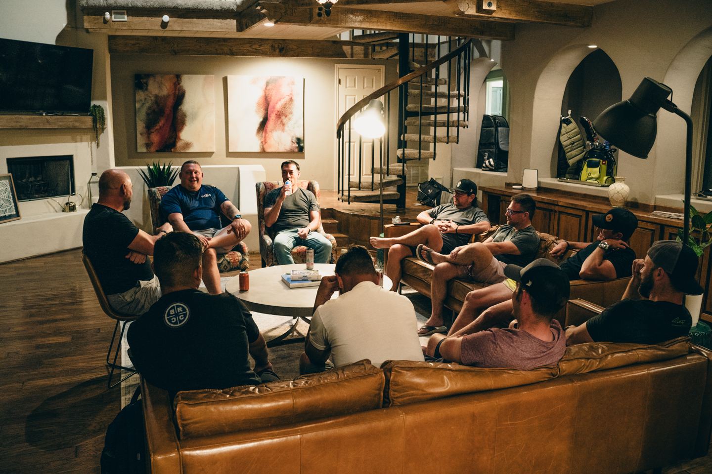 Mastermind members gathered in a living room, listening to one another