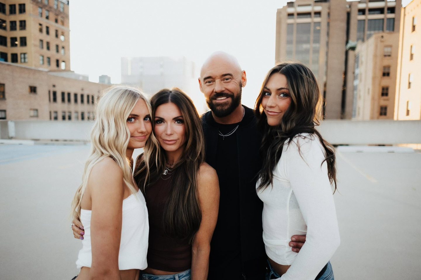 Shawn Feurer with his family on a city rooftop