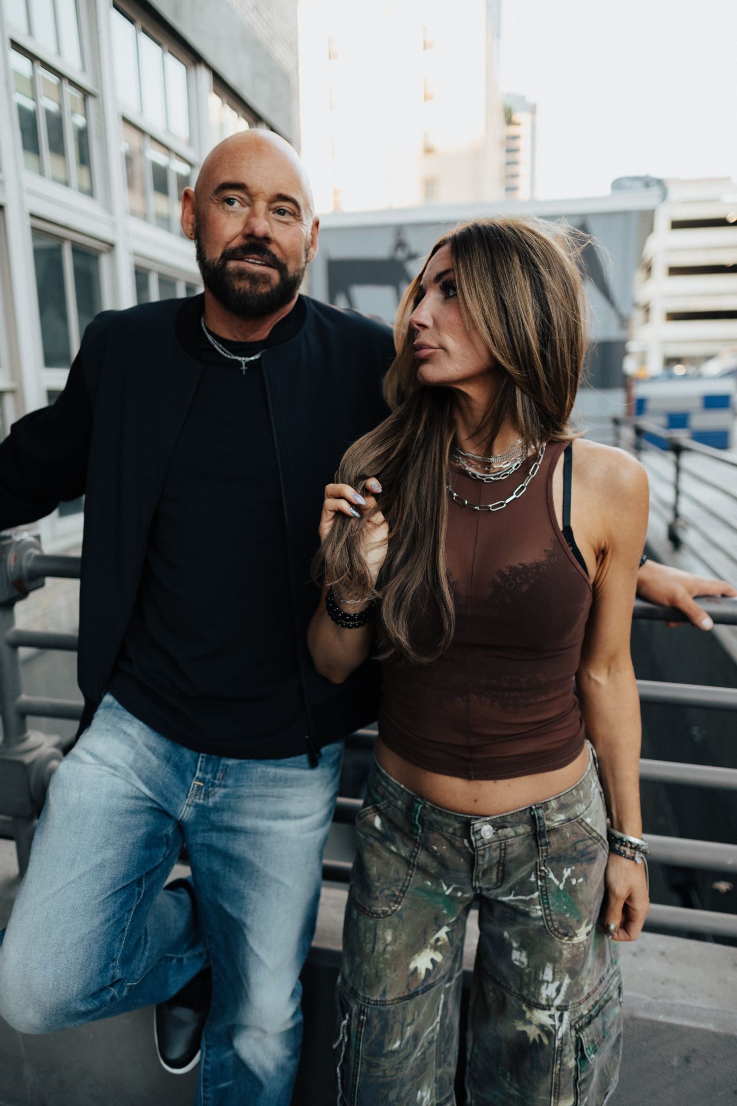 Shawn Feurer with his wife on a city rooftop